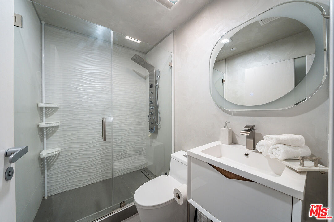 5010 Fulton Avenue Sherman Oaks, CA 91423 - Photo 40 of 55 a bathroom with a sink a toilet and shower