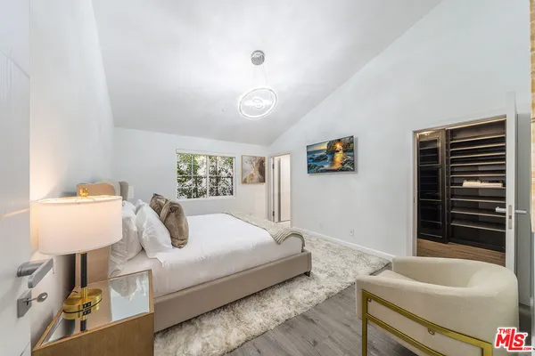 a bathroom with a bathtub and a window