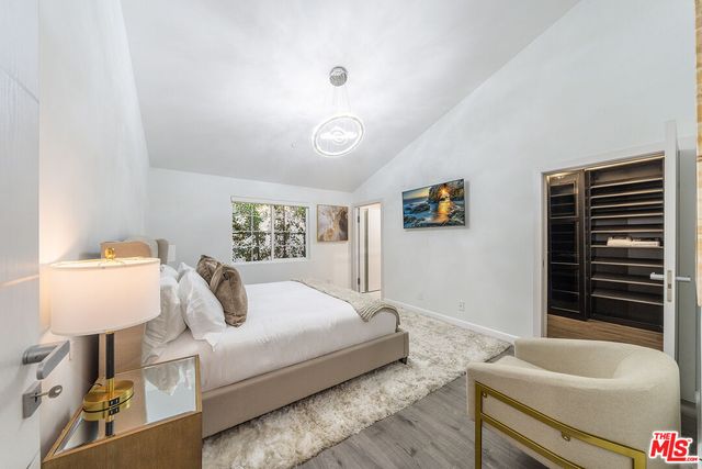 a bathroom with a bathtub and a window