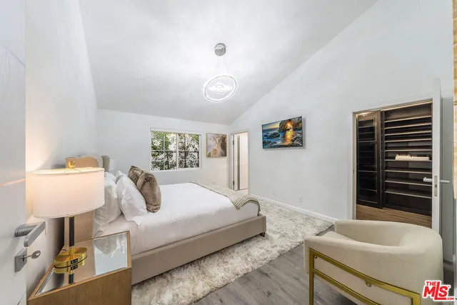 a bathroom with a bathtub and a window