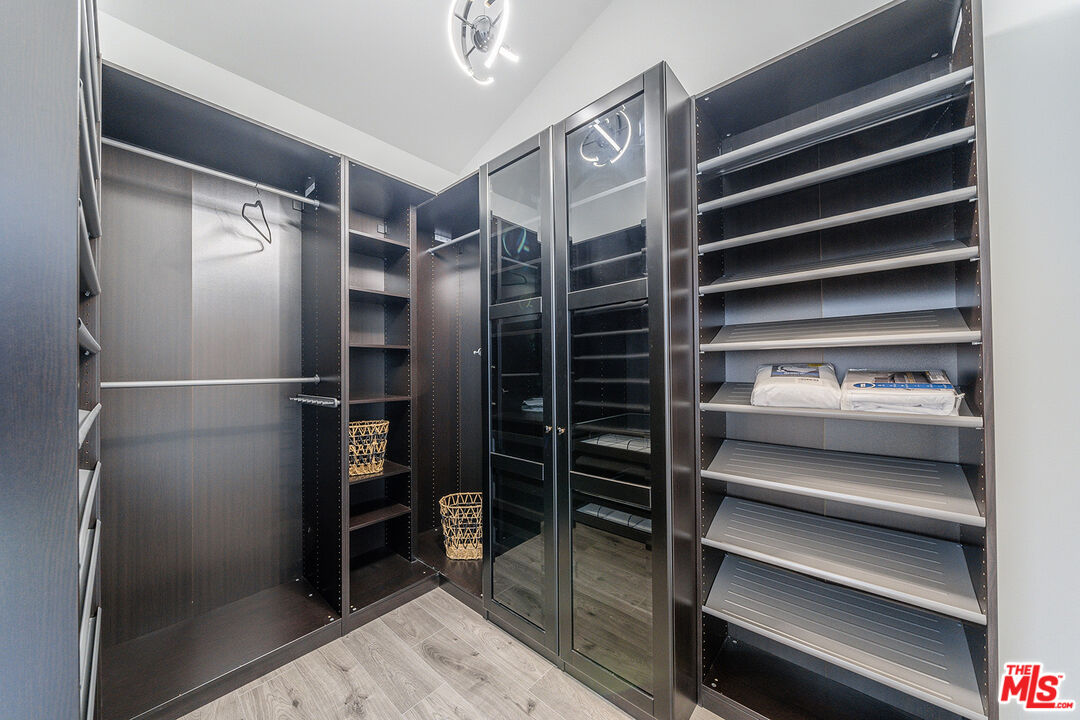5010 Fulton Avenue Sherman Oaks, CA 91423 - Photo 42 of 55 a view of walk in closet with empty racks