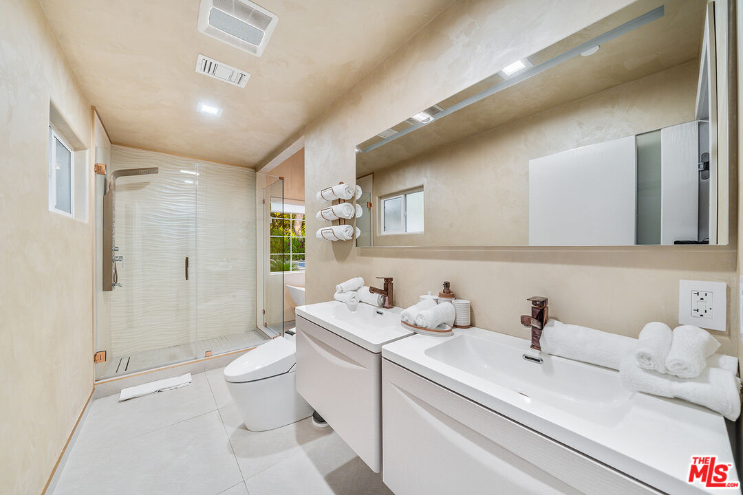 5010 Fulton Avenue Sherman Oaks, CA 91423 - Photo 44 of 55 a bathroom with a sink toilet vanity and shower