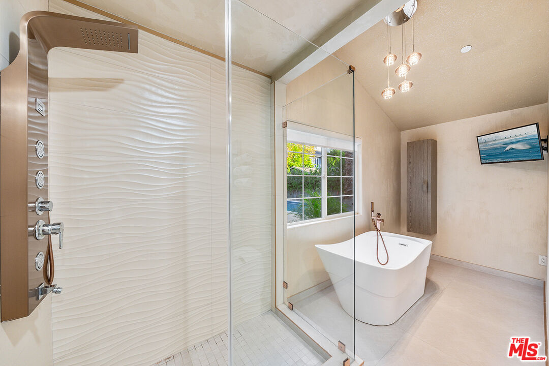 5010 Fulton Avenue Sherman Oaks, CA 91423 - Photo 45 of 55 a bathroom with a bathtub and shower