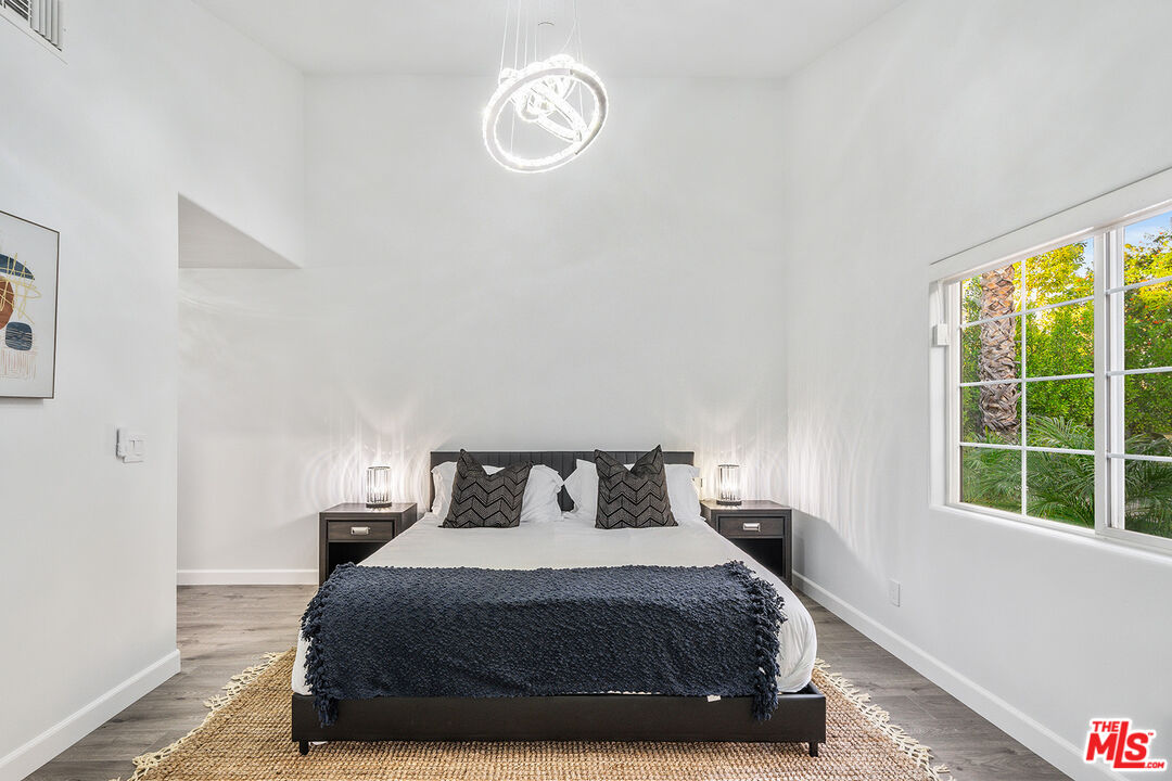 5010 Fulton Avenue Sherman Oaks, CA 91423 - Photo 50 of 55 a bedroom with a bed and a window