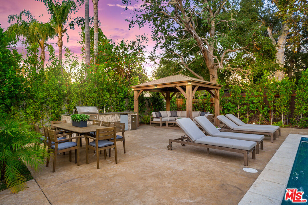 5010 Fulton Avenue Sherman Oaks, CA 91423 - Photo 5 of 55 a view of backyard with swimming pool and furniture