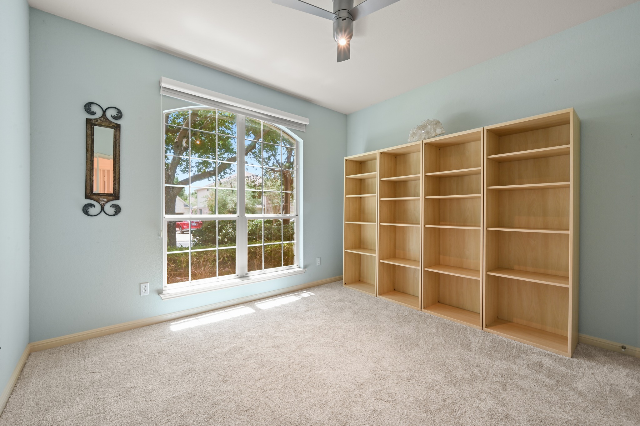 7301 Seneca Falls Loop Austin, TX 78739 - Photo 23 of 36 Secondary bedroom with large picture window, nice sized walk in closet and brand new carpet.