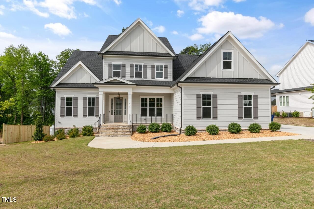 816 Crimson Rdg Trail Fuquay-Varina, NC 27526 - Photo 1 of 42 front view of a house with a yard