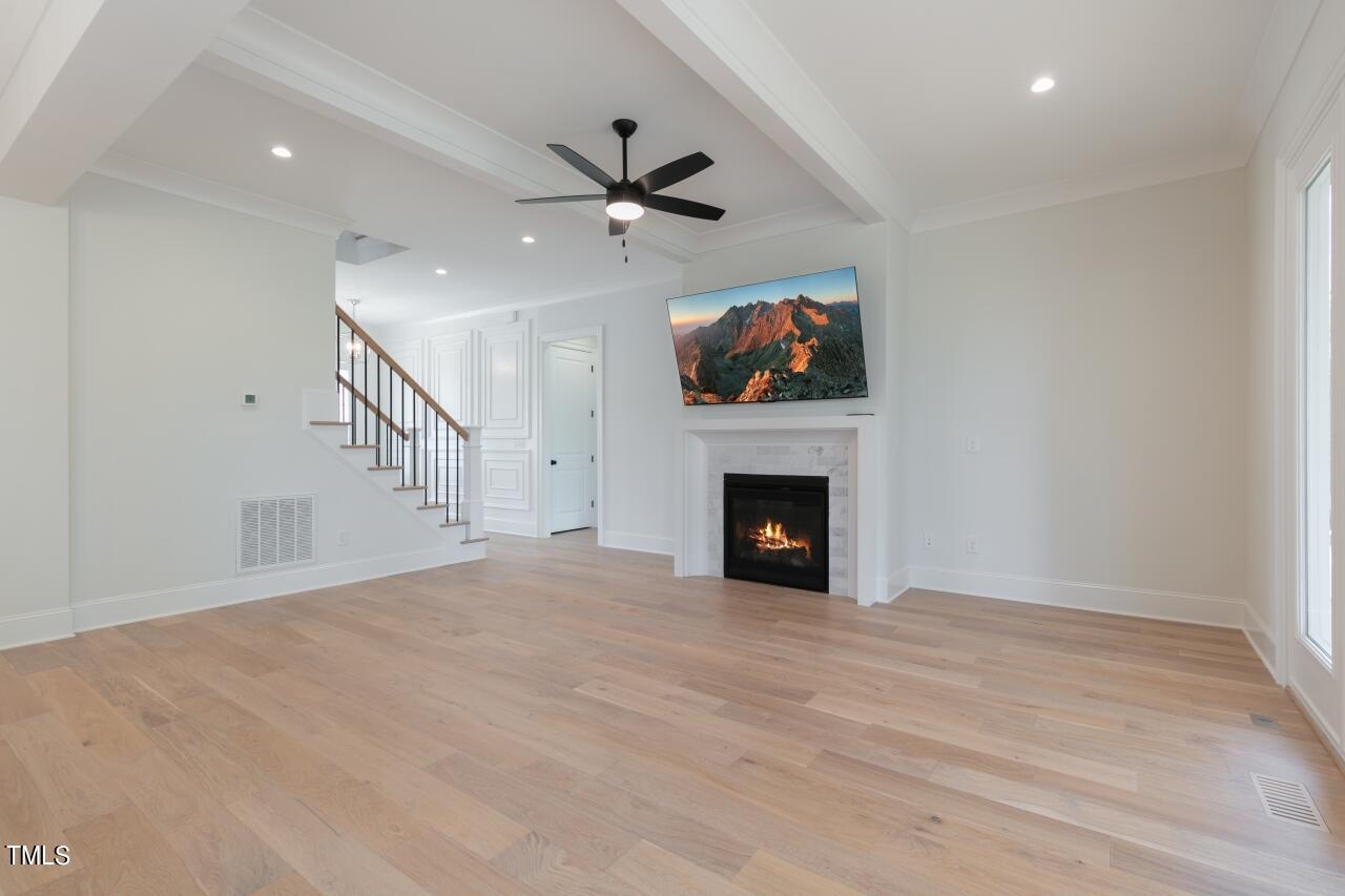 816 Crimson Rdg Trail Fuquay-Varina, NC 27526 - Photo 12 of 42 a view of empty room with a fireplace