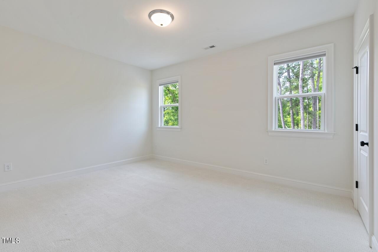 816 Crimson Rdg Trail Fuquay-Varina, NC 27526 - Photo 31 of 42 an empty room with windows