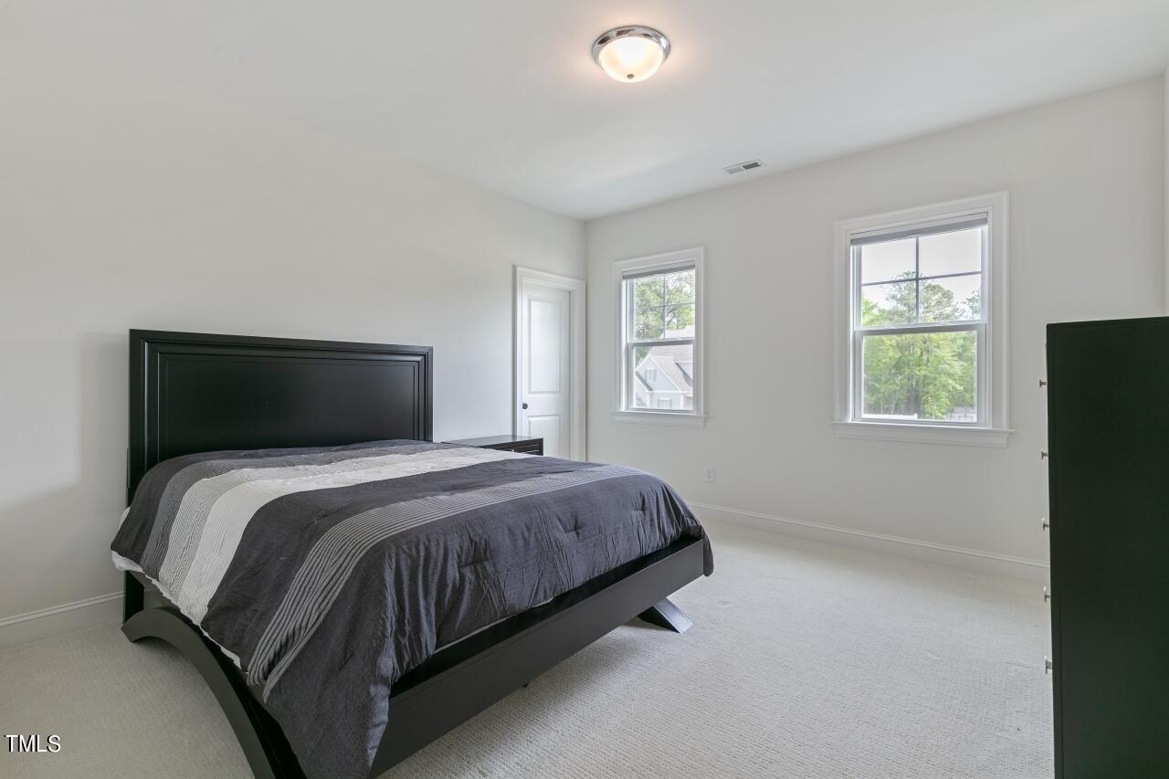 816 Crimson Rdg Trail Fuquay-Varina, NC 27526 - Photo 33 of 42 a bedroom with a bed and a window