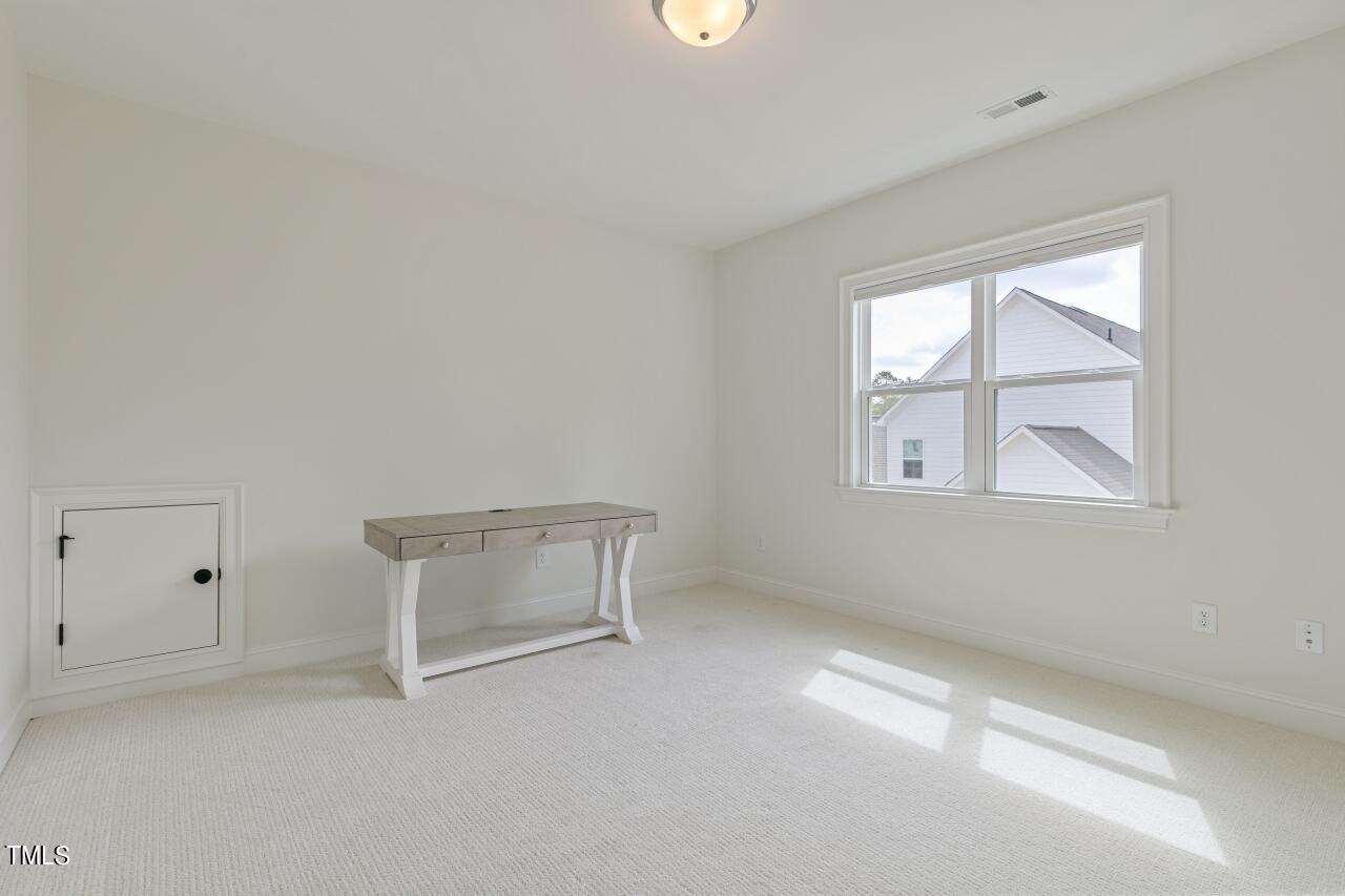 816 Crimson Rdg Trail Fuquay-Varina, NC 27526 - Photo 35 of 42 an empty room with a window