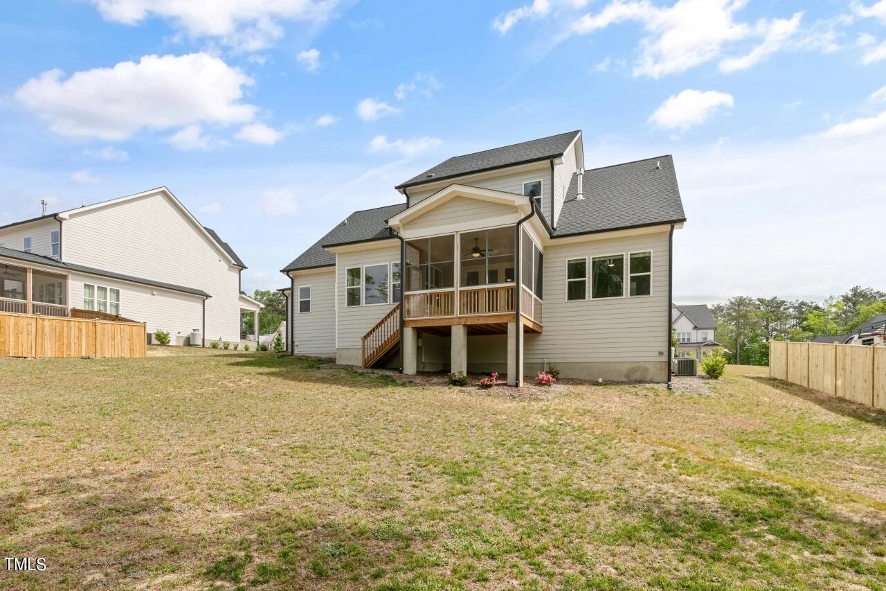 816 Crimson Rdg Trail Fuquay-Varina, NC 27526 - Photo 39 of 42 a view of a house with a yard