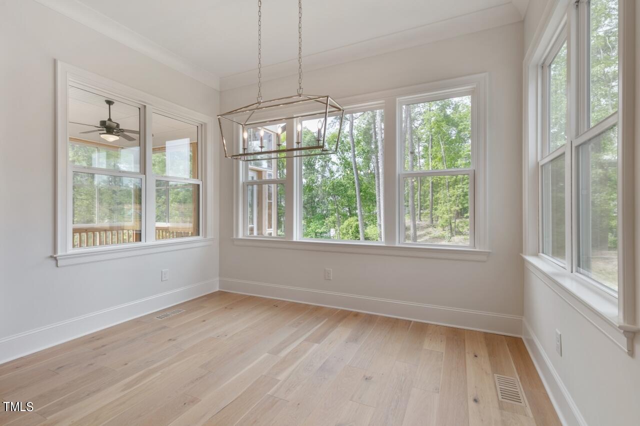 816 Crimson Rdg Trail Fuquay-Varina, NC 27526 - Photo 9 of 42 a view of room with window and hardwood floor