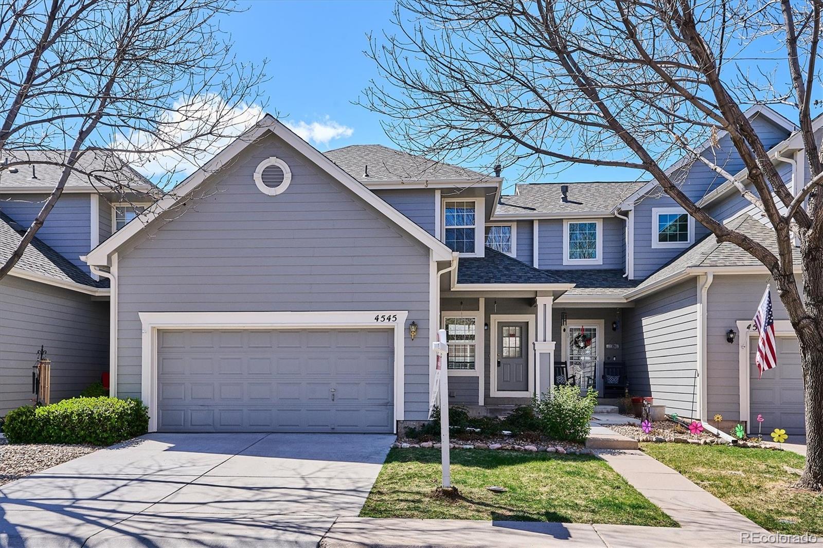 4545 South Taft Way Morrison, CO 80465 - Photo 2 of 24 a front view of a house with garden
