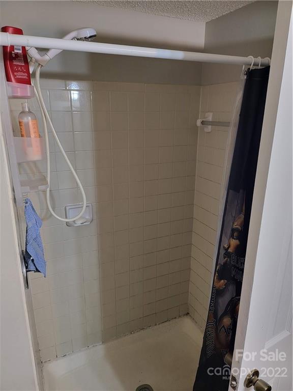 9405 Old Concord Road, Unit D Charlotte, NC 28213 - Photo 15 of 17 a bathroom with a shower