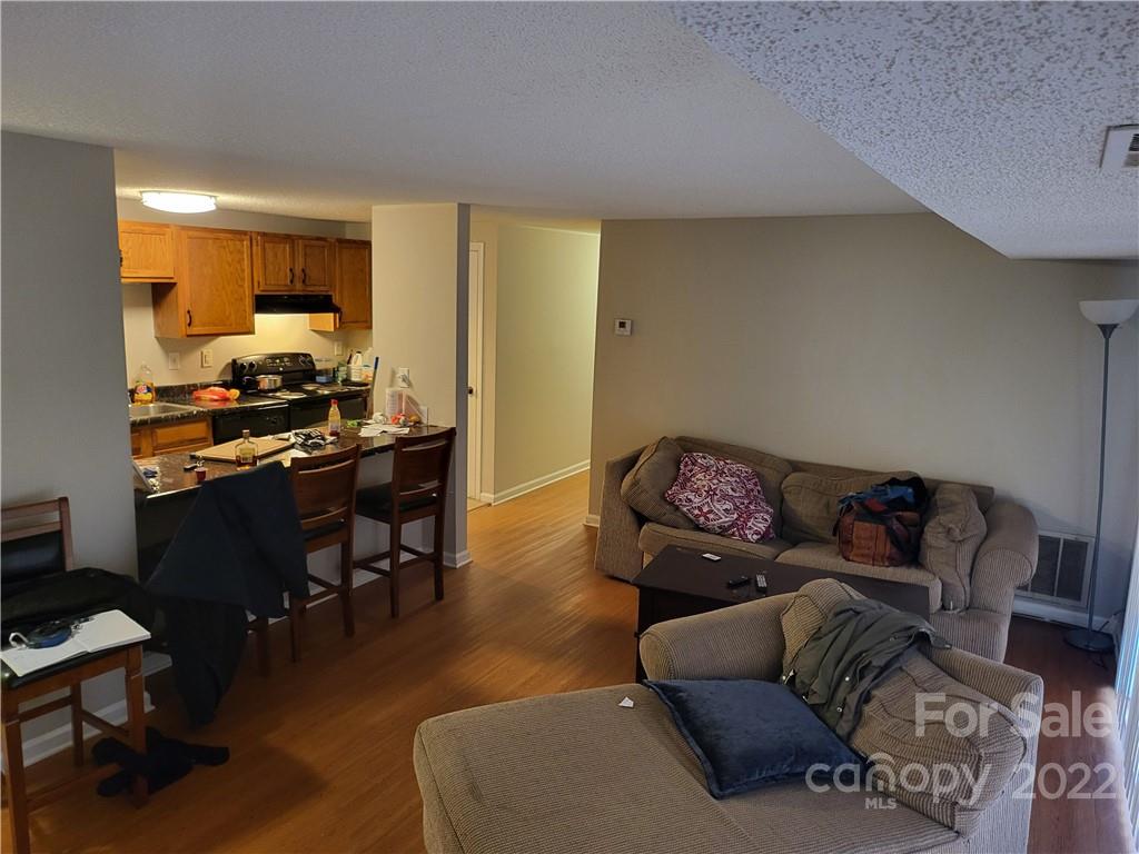 9405 Old Concord Road, Unit D Charlotte, NC 28213 - Photo 10 of 17 a living room with furniture and a flat screen tv