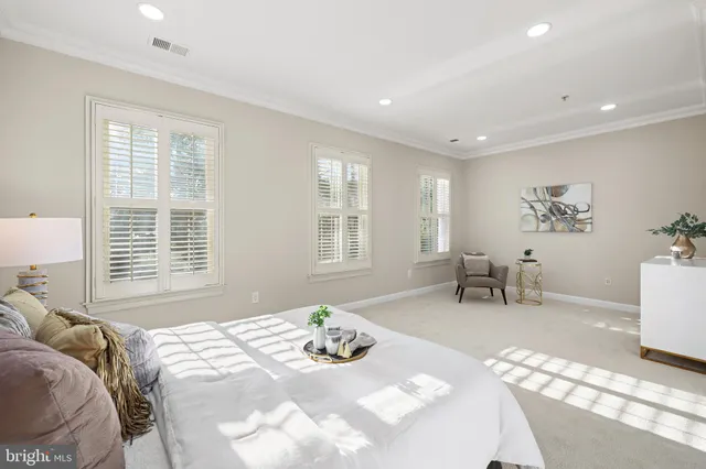 a bedroom with a bed and a table