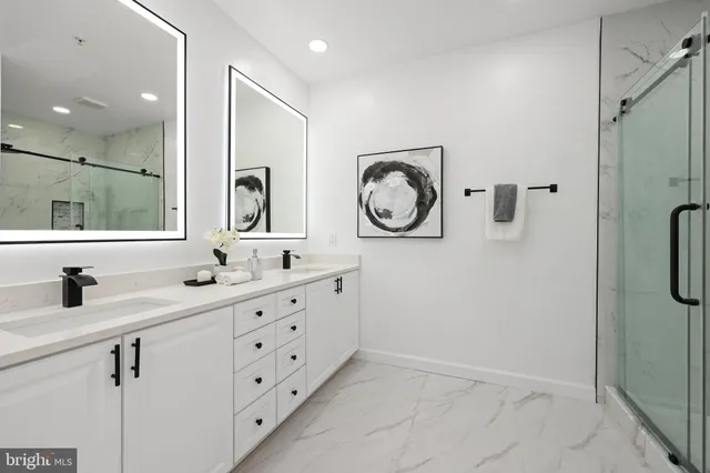 a bathroom with a double vanity sink and a mirror
