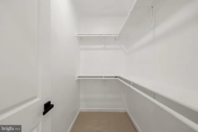 a view of an empty walk in closet