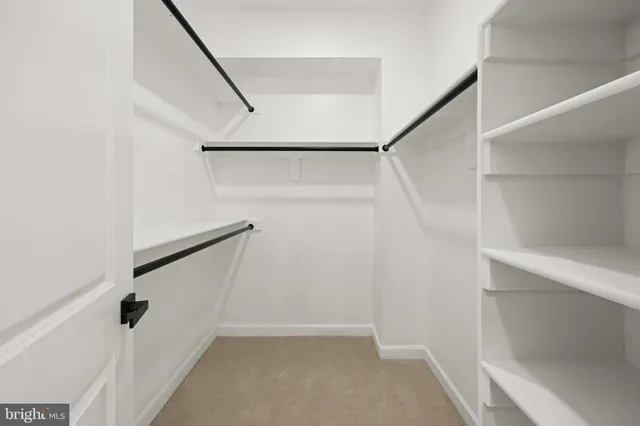 a view of staircase with white walls