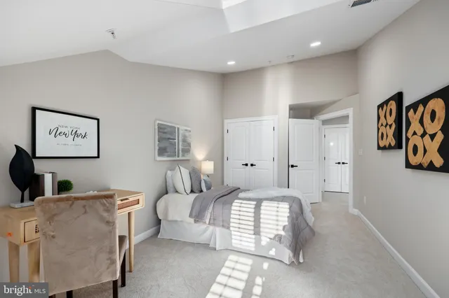 a bedroom with furniture and window