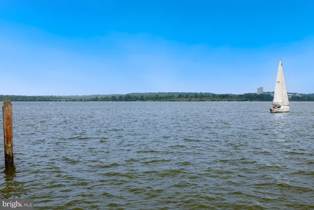 a lake view with couple of chairs