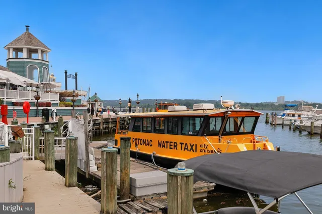 a view of a house with roof deck and sitting area
