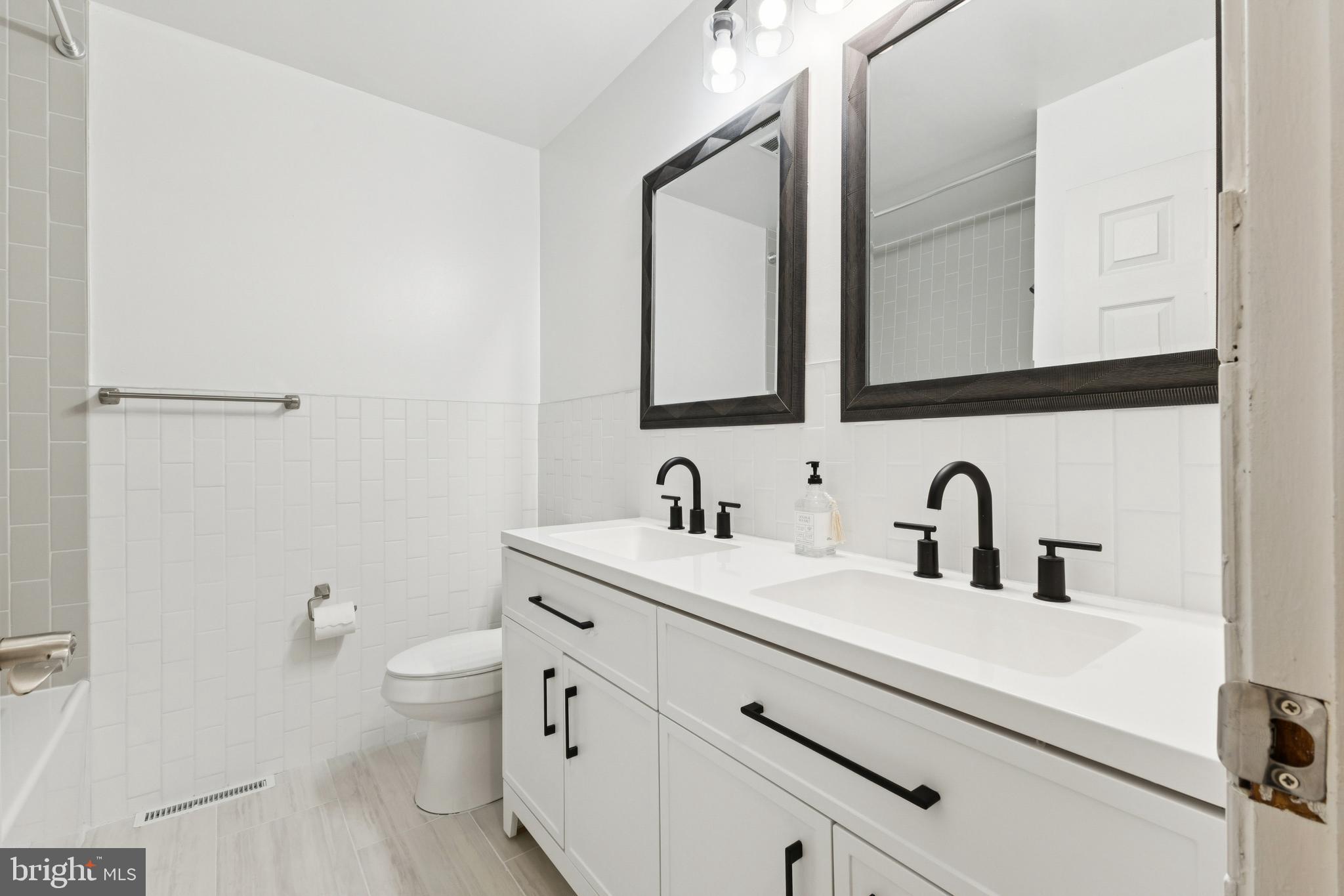28 Ridgemore Circle Fredericksburg, VA 22405 - Photo 11 of 32 Hall bathroom with dual sinks & ceramic tile floor