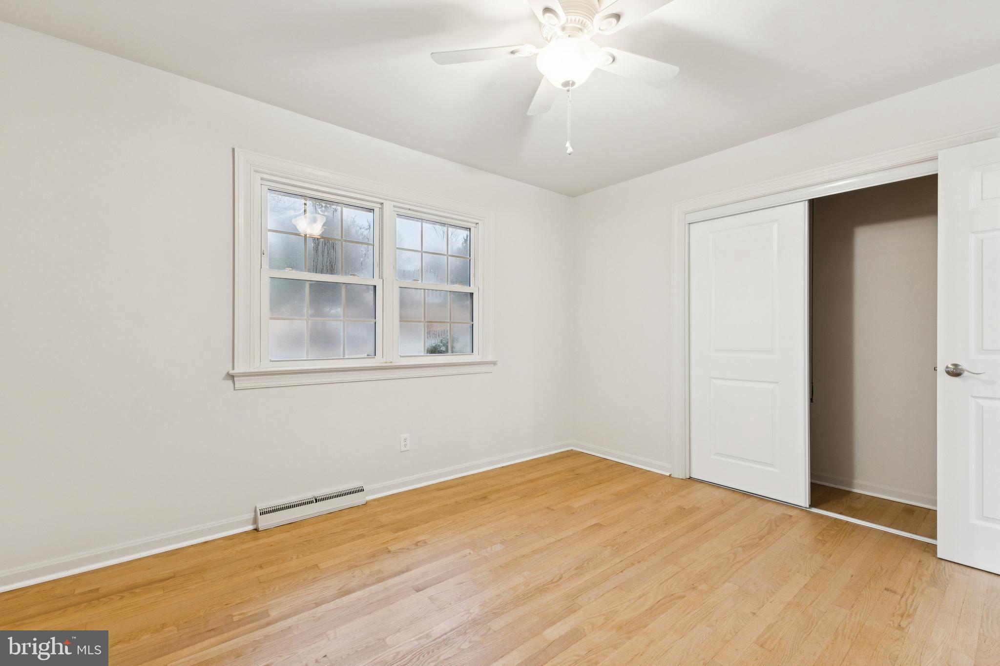 28 Ridgemore Circle Fredericksburg, VA 22405 - Photo 10 of 34 a view of empty room with wooden floor and fan