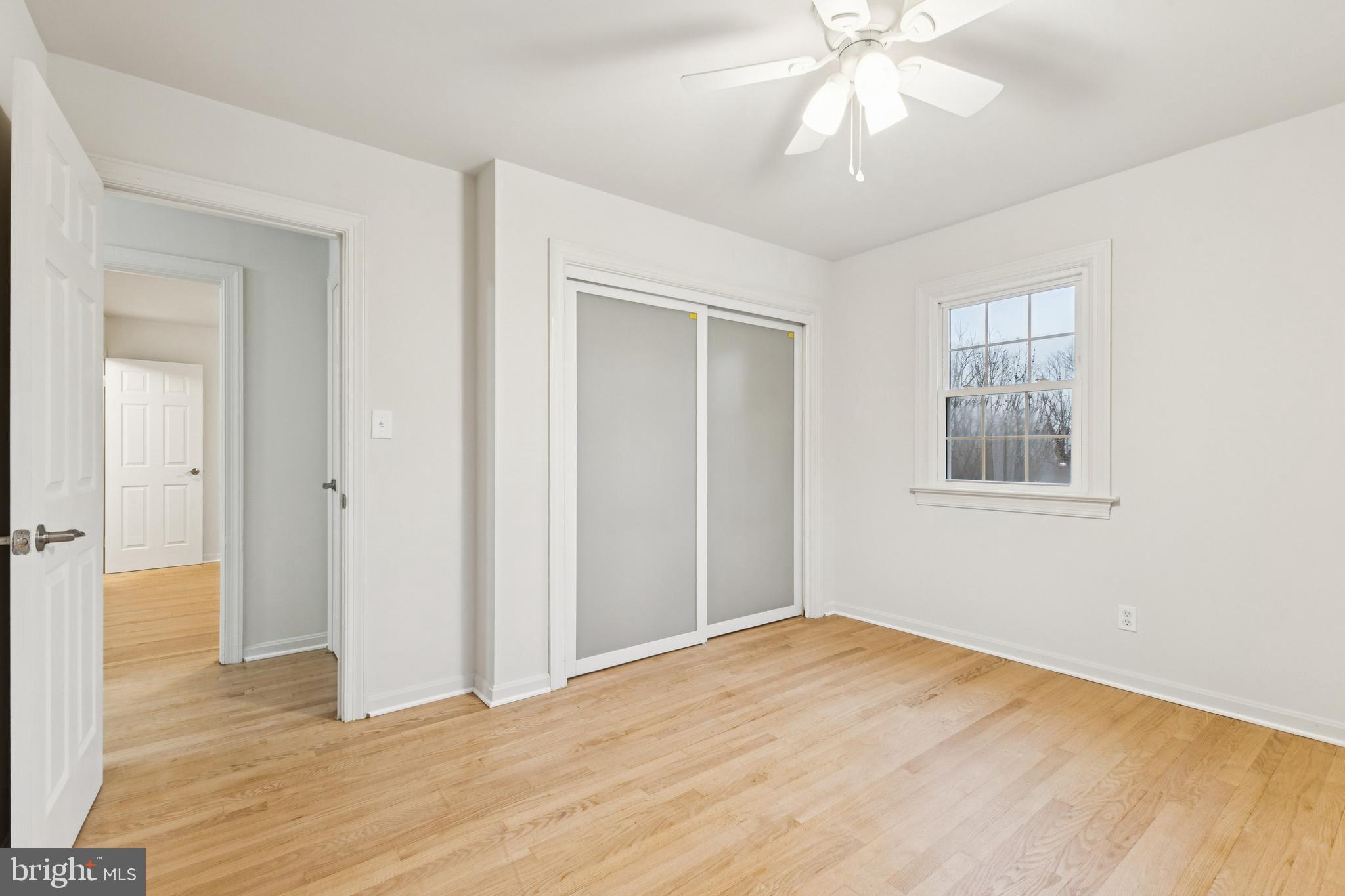 28 Ridgemore Circle Fredericksburg, VA 22405 - Photo 13 of 34 a view of an empty room with wooden floor and a window
