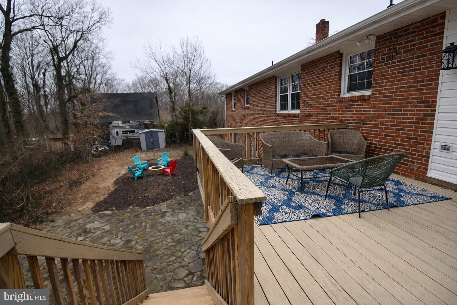 28 Ridgemore Circle Fredericksburg, VA 22405 - Photo 30 of 34 a roof deck view with table and chairs and wooden floor