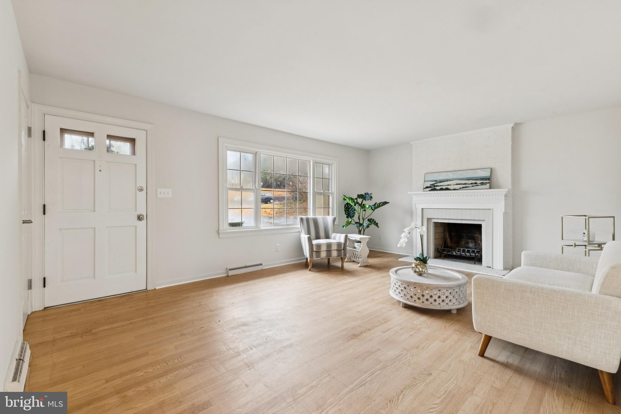 28 Ridgemore Circle Fredericksburg, VA 22405 - Photo 3 of 34 a living room with furniture and a fireplace