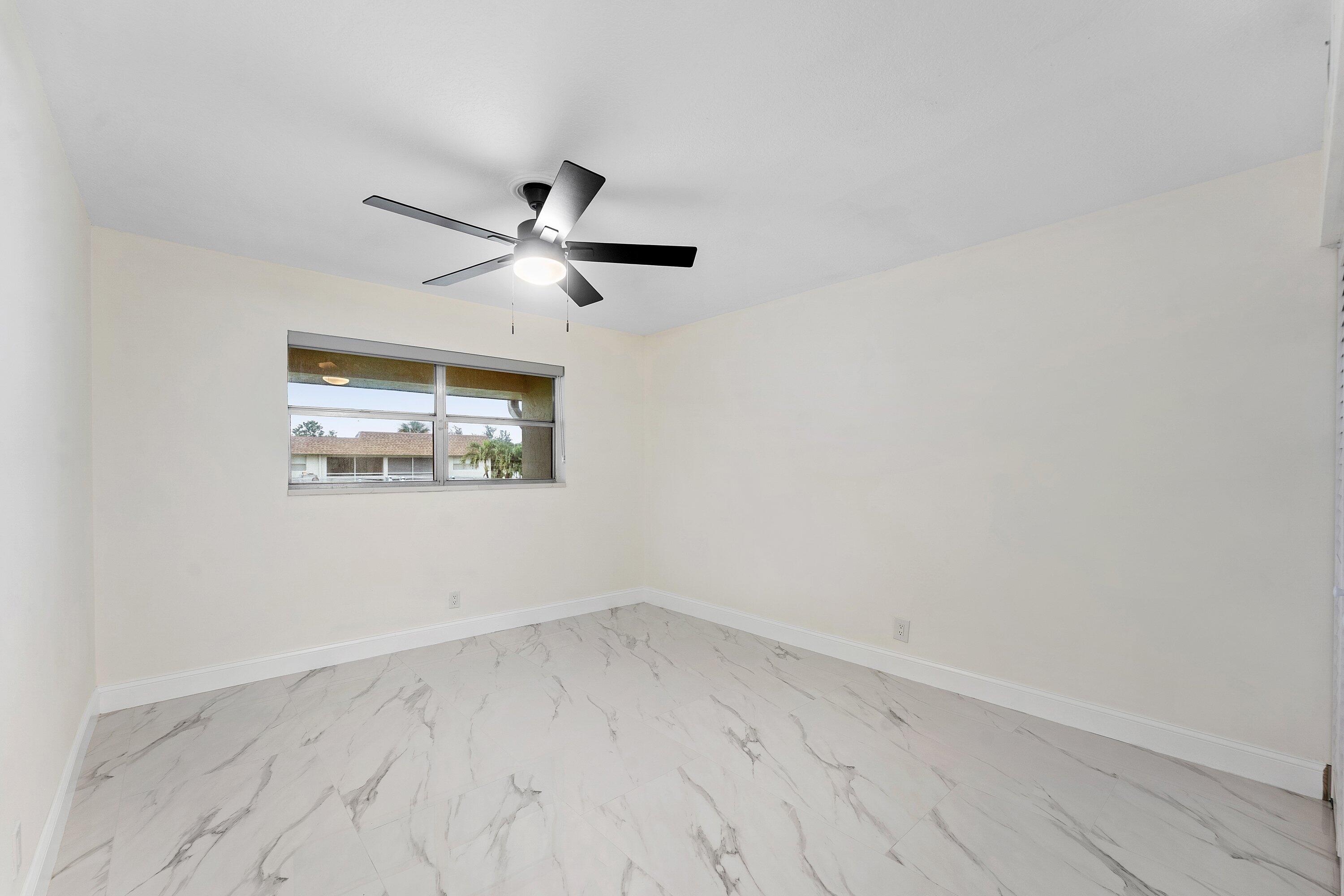 9911 Sandalfoot Boulevard, Unit 113 Boca Raton, FL 33428 - Photo 13 of 19 an empty room