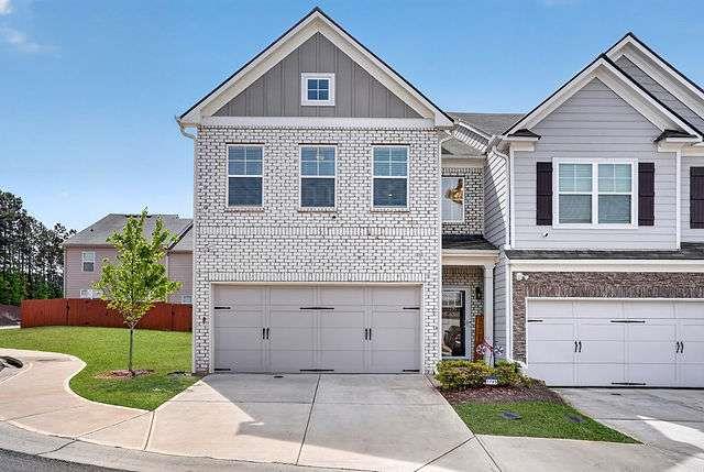 7795 Baron Road Fairburn, GA 30213 - Photo 1 of 40 a front view of a house with a garden
