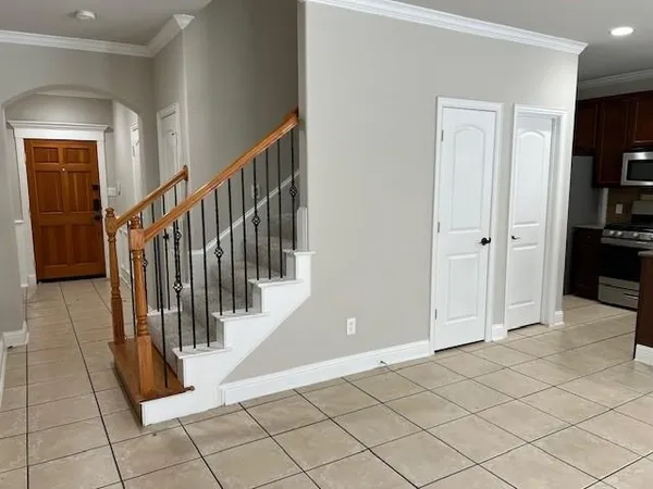 a view of a hallway with entryway and closet