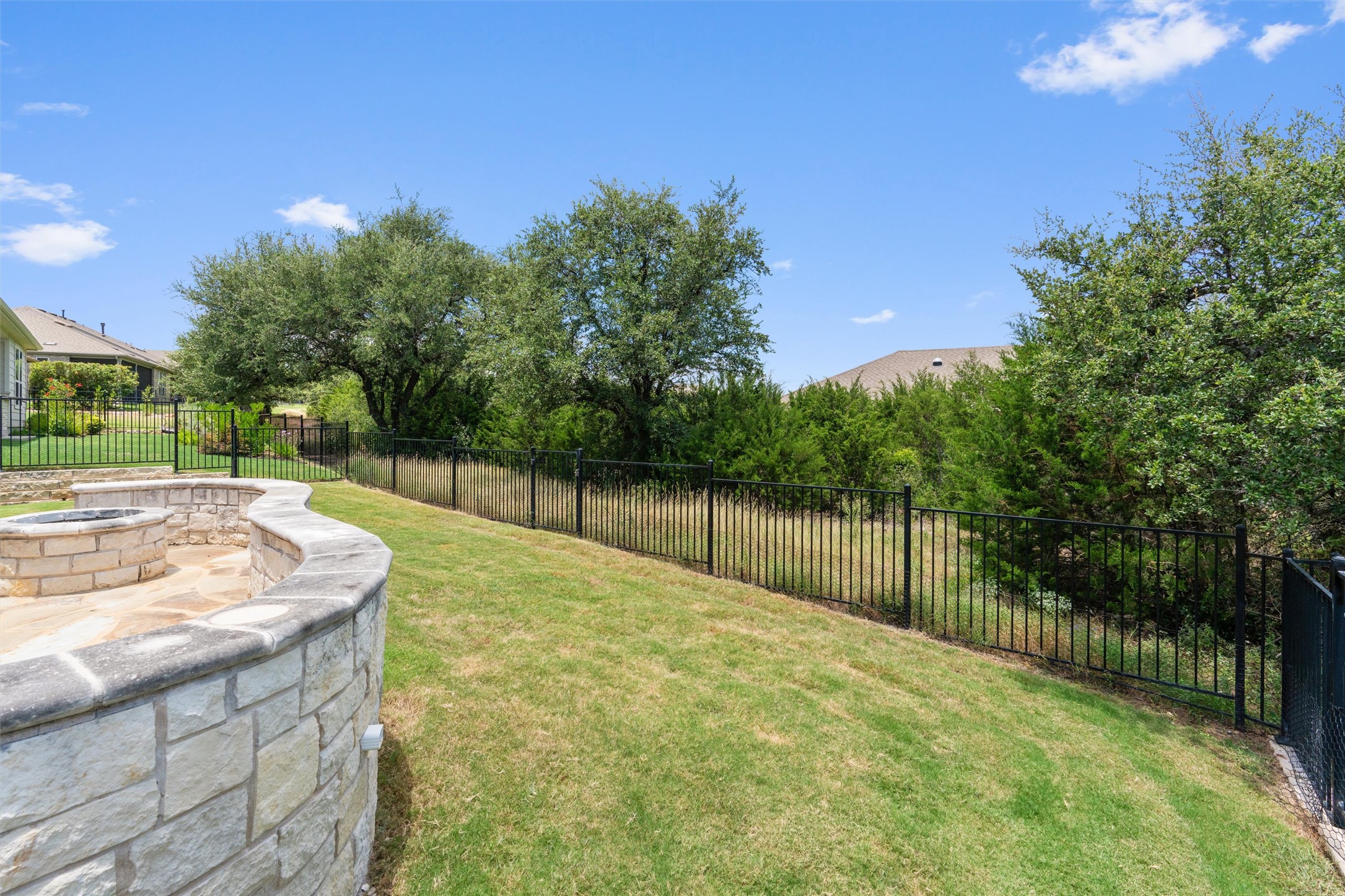 202 Spanish Star Street Georgetown, TX 78633 - Photo 29 of 32 a backyard of a house with lots of green space