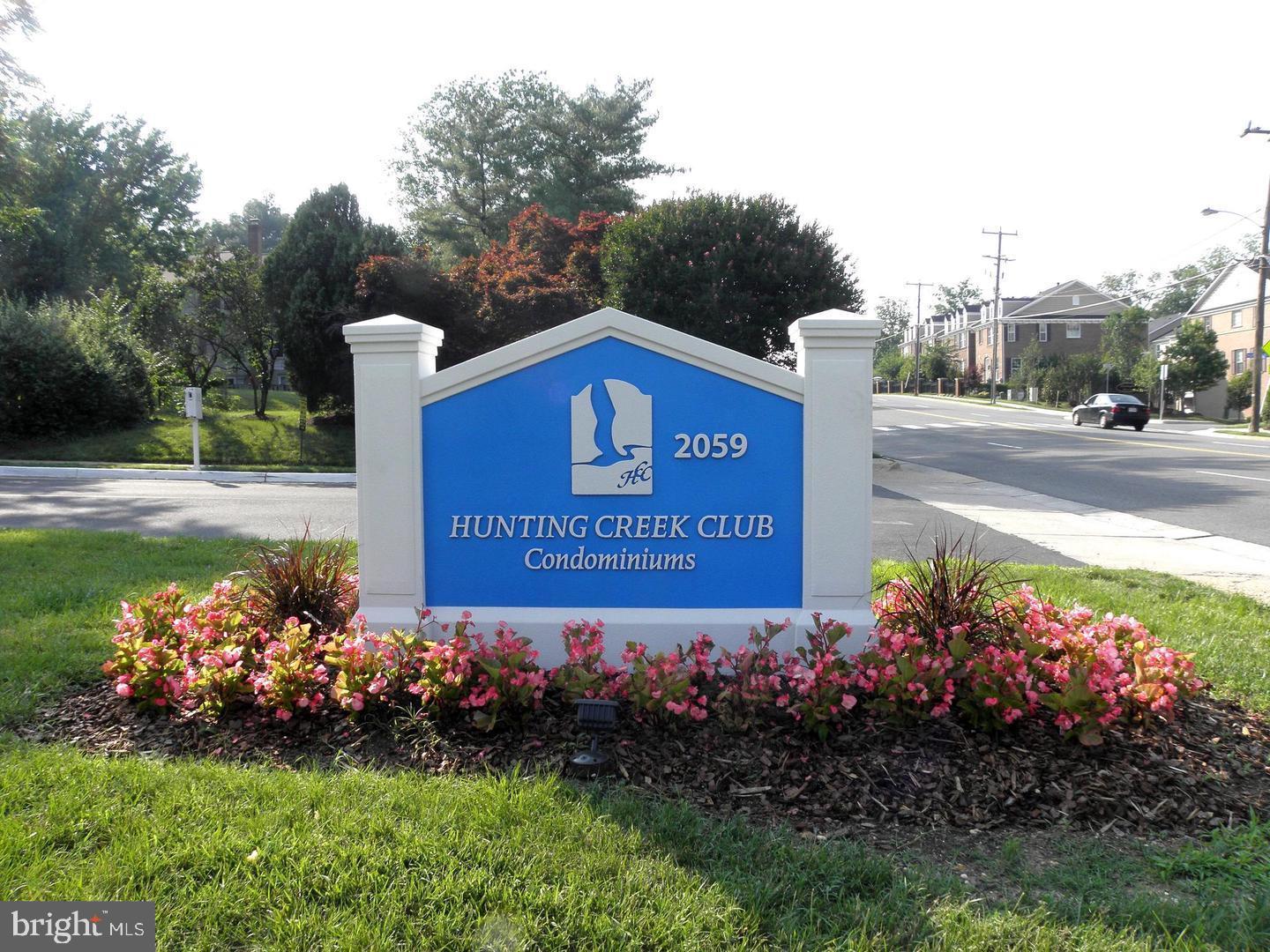 2059 Huntington Avenue, Unit 312 Alexandria, VA 22303 - Photo 19 of 33 a sign that is in front of flowers