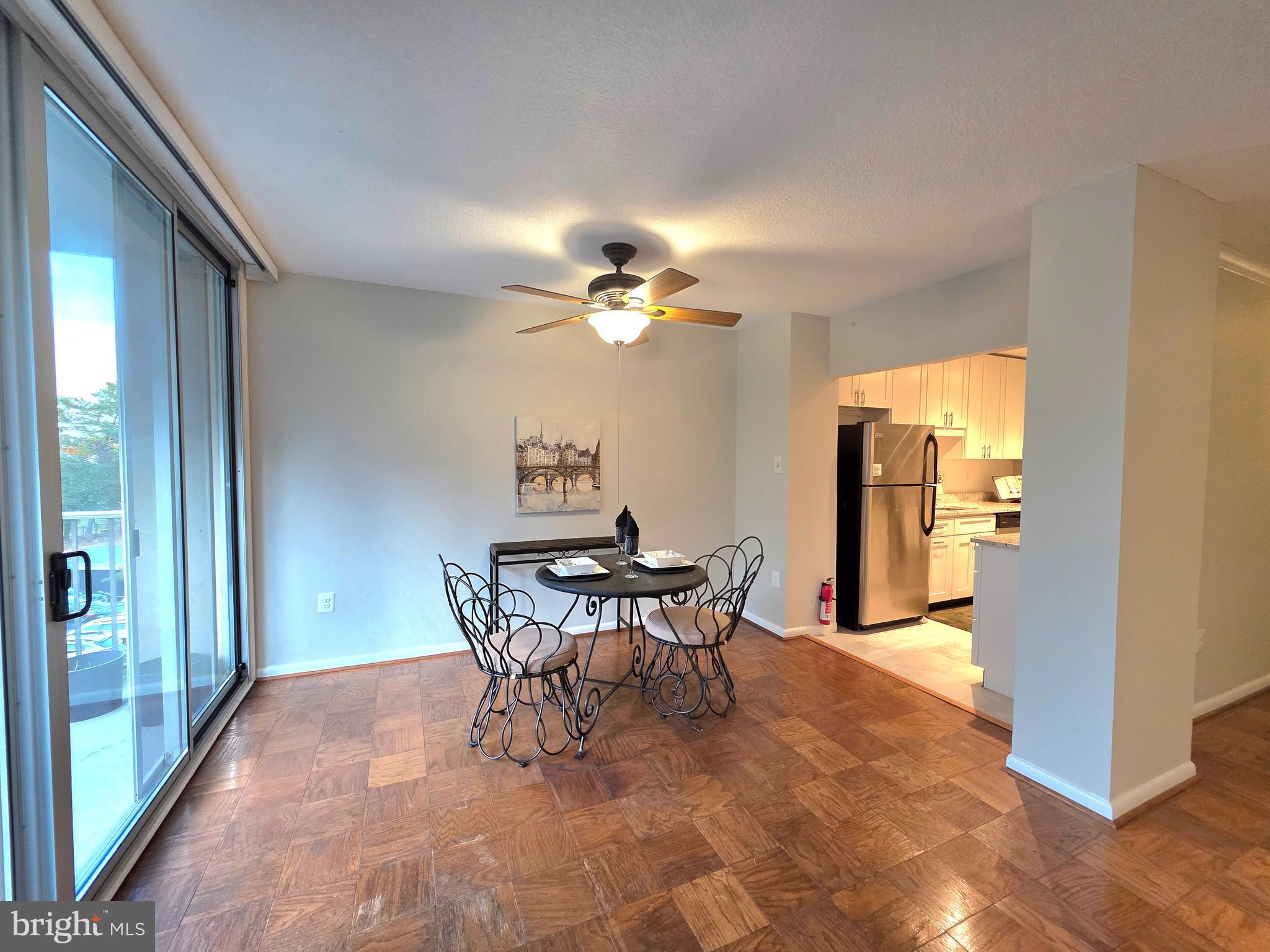 2059 Huntington Avenue, Unit 312 Alexandria, VA 22303 - Photo 5 of 33 a view of a dining room with furniture and a chandelier