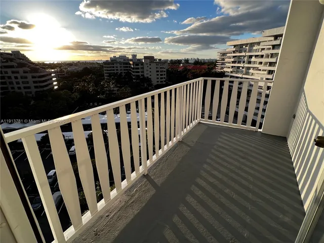 a view of balcony with furniture