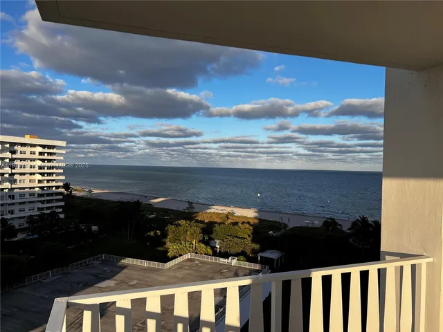 a view of balcony with furniture