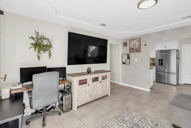 a living room with furniture and a rug
