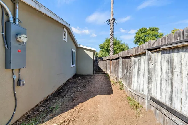 an aerial view of a house with yard and staircase