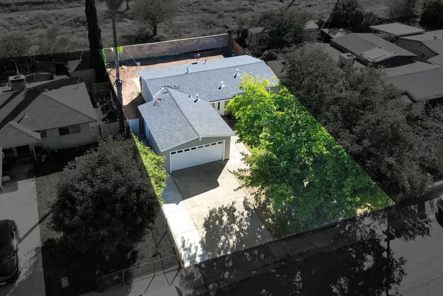 an aerial view of residential houses with outdoor space