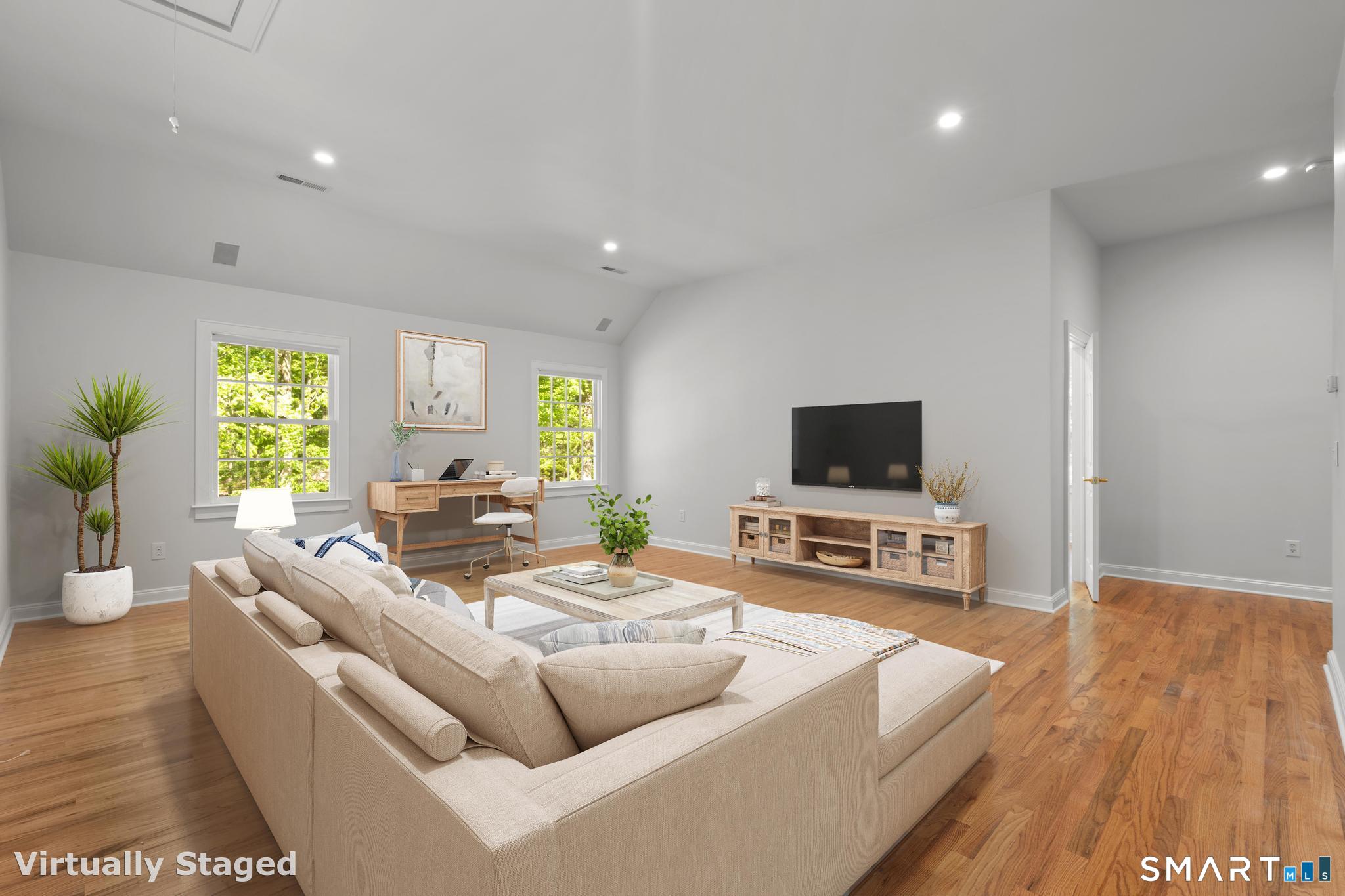 181 Old Branchville Road Ridgefield, CT 06877 - Photo 18 of 40 a living room with furniture and a flat screen tv
