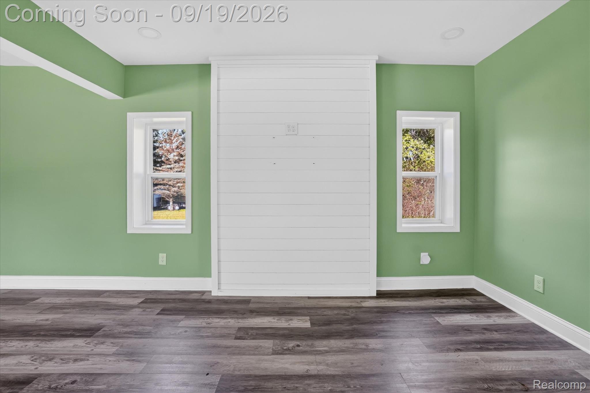 10215 West Mount Morris Road Flushing, MI 48433 - Photo 19 of 58 Wood-finish flooring, recessed lighting, and a shiplap accent wall