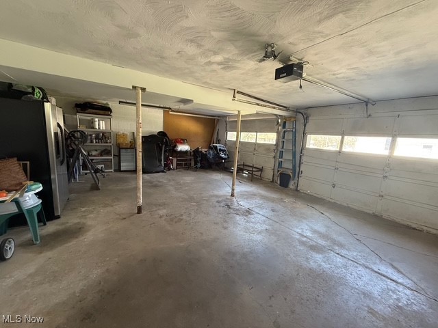 4669 Mars Road Uniontown, OH 44685 - Photo 28 of 31 Garage featuring a garage door opener