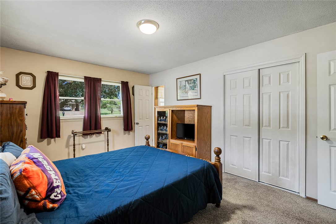 312 Edwards Drive Anderson, SC 29626 - Photo 16 of 44 Well-lit room with ample natural light, featuring a comfortable bed.