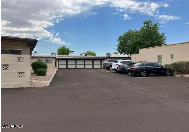 a view of street with parked cars