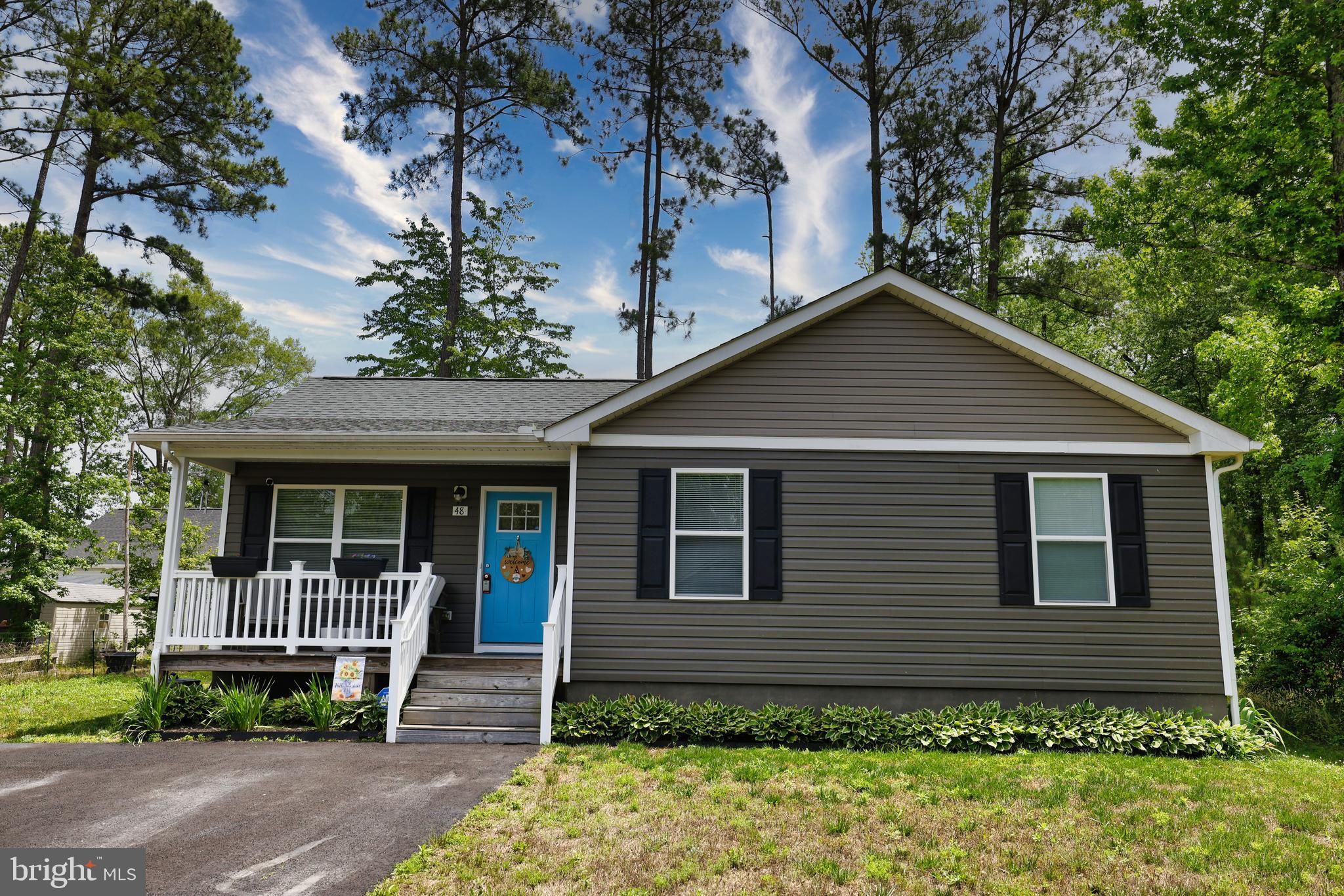 48 Rustic Lane Colonial Beach, VA 22443 - Photo 3 of 47 a front view of a house with garden