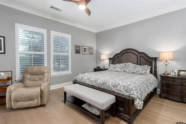 a bedroom with bed and a window